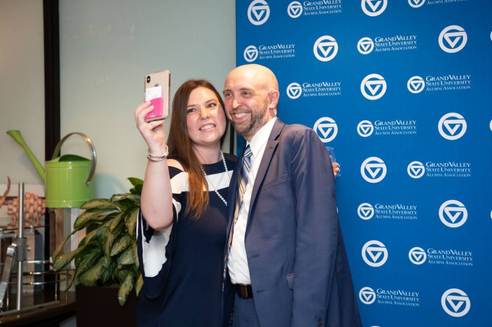 man and woman selfie at photo station